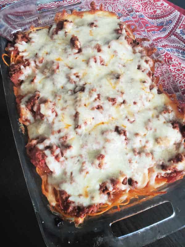 million dollar spaghetti casserole in a glass baking dish