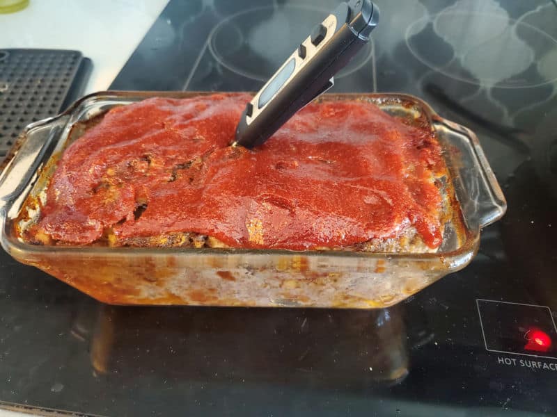 meat thermometer in Stove Top Meatloaf in a glass baking dish. 