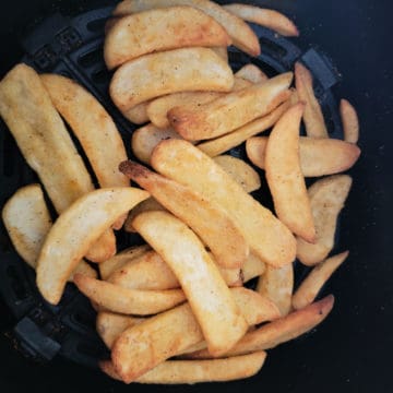 air fried french fries in an air fryer basket