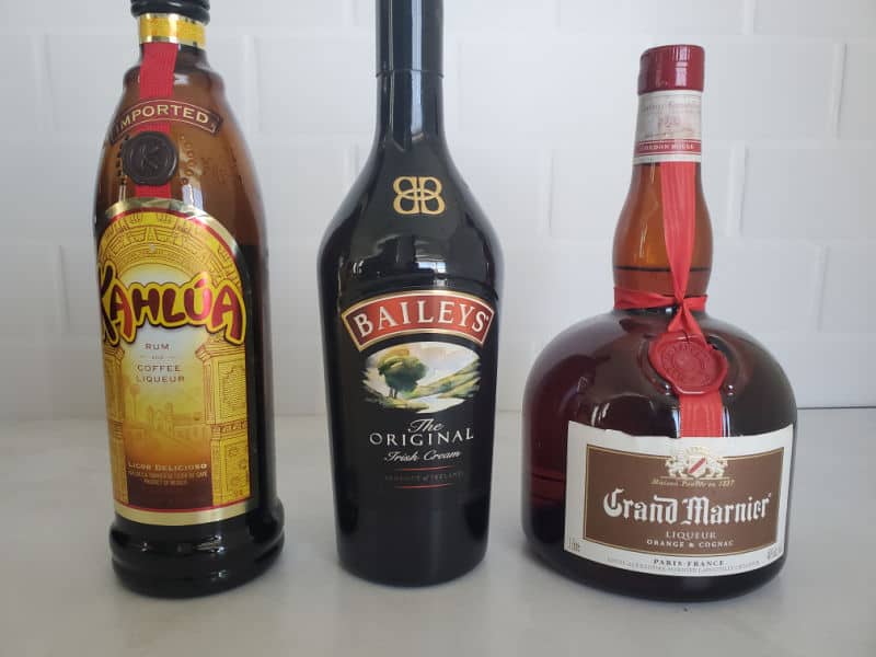 B52 shot ingredients, Kahlua, Bailey's and Grand Marnier Bottles