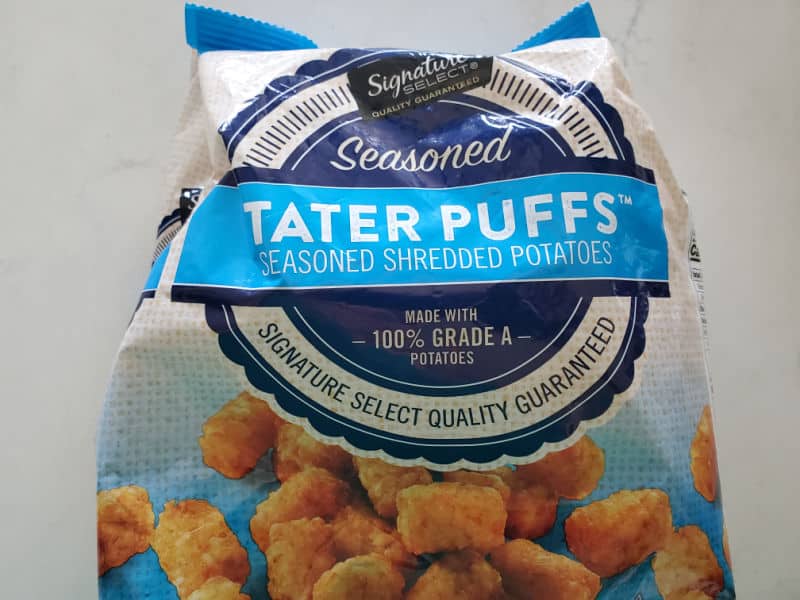 Bag of frozen tater tots on a white counter