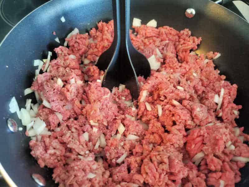 ground beef and onions in a skillet