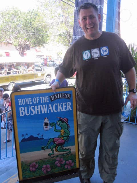 Park Ranger John next to a home of the Baileys Bushwacker sign