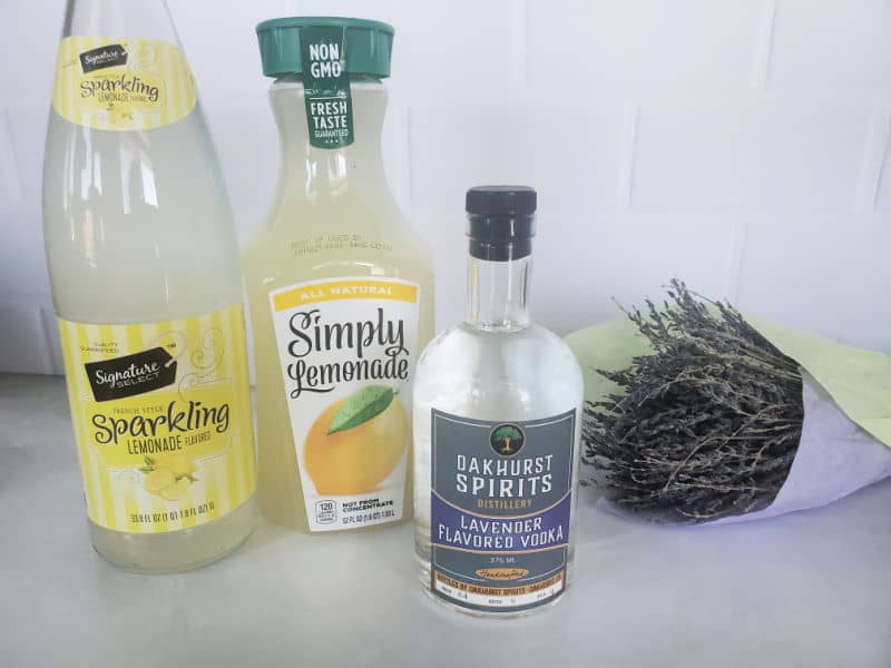 Sparkling Lemonade, Simply Lemonade, and Oakhurst Spirits Lavender Vodka next to a bundle of lavender 