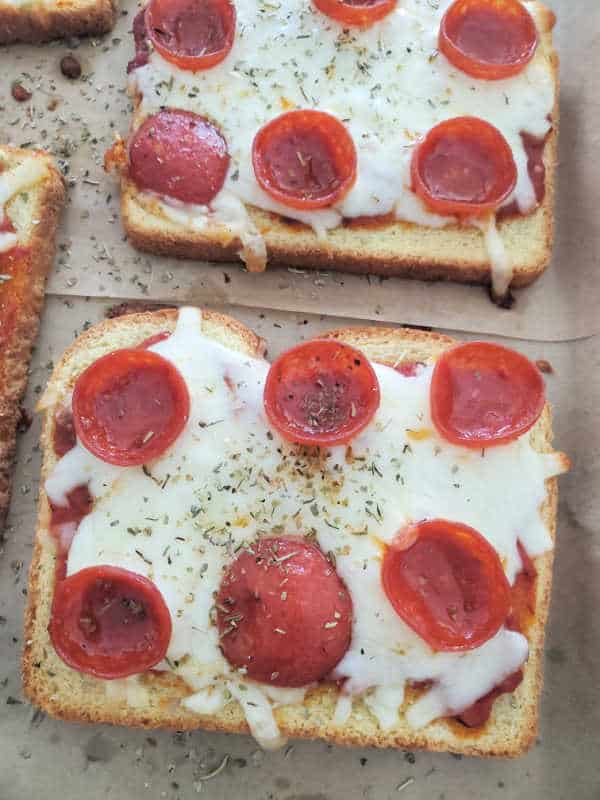pepperoni pizza toast on a parchment baking sheet