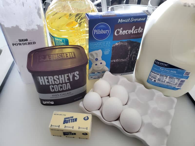 Texas sheet cake cookie ingredients Hershey's cocoa, butter, eggs, milk, chocolate cake mix, oil, and powdered sugar