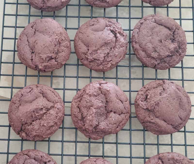 Texas sheet cake chocolate cookies on a drying rack