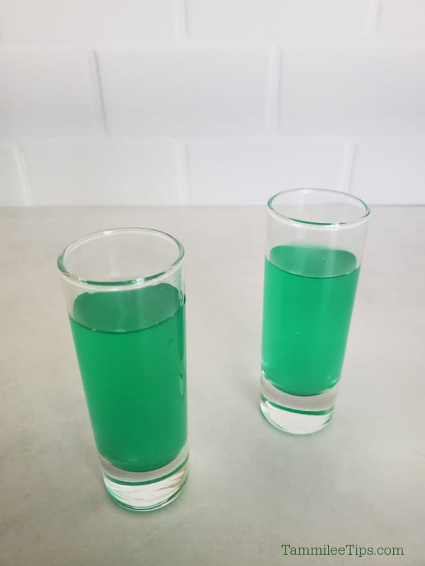 two green liquid marijuana shots