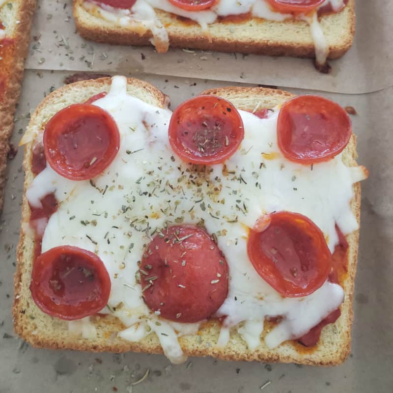 slice of pepperoni pizza toast on parchment paper