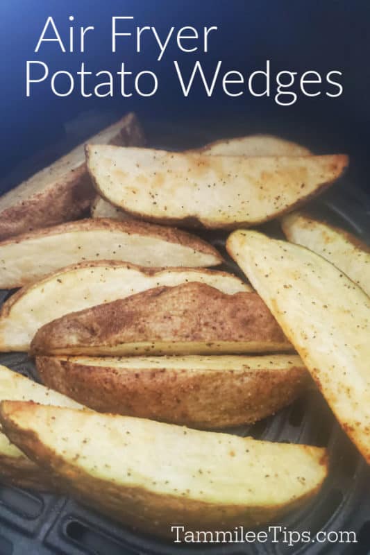 Air Fryer potato wedges over seasoned potatoes in an air fryer basket