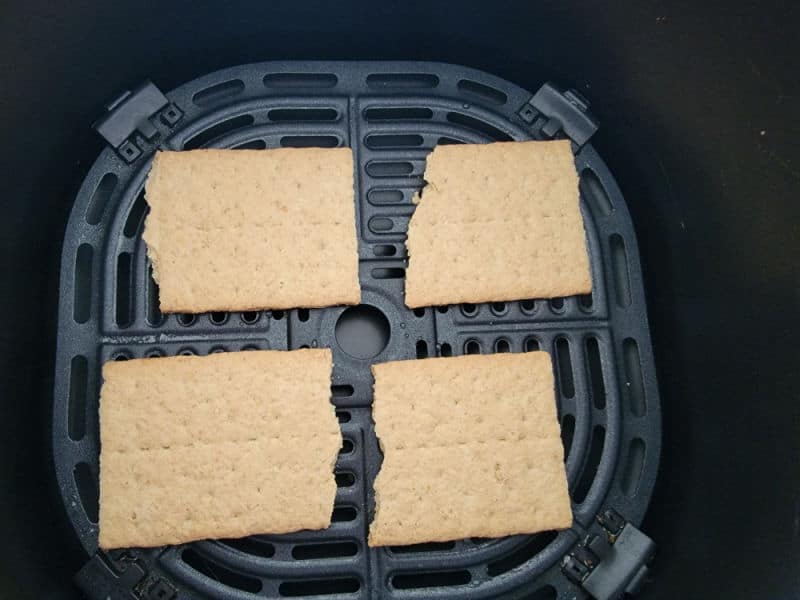 Graham cracker squares in an air fryer basket