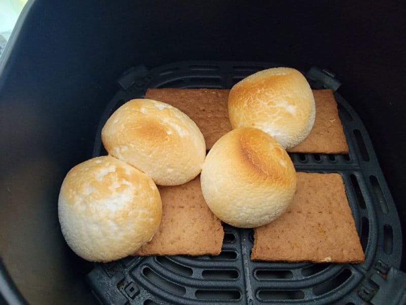 air fried marshmallows on graham cracker squares in an air fryer