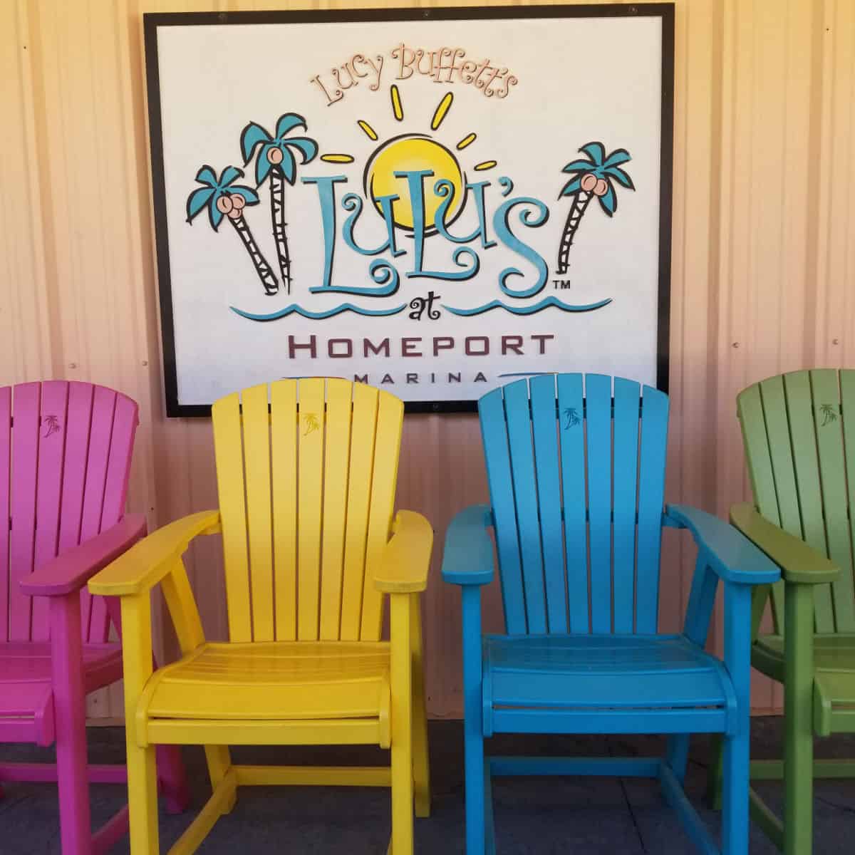 Adirondack chairs below a LuLu's sign