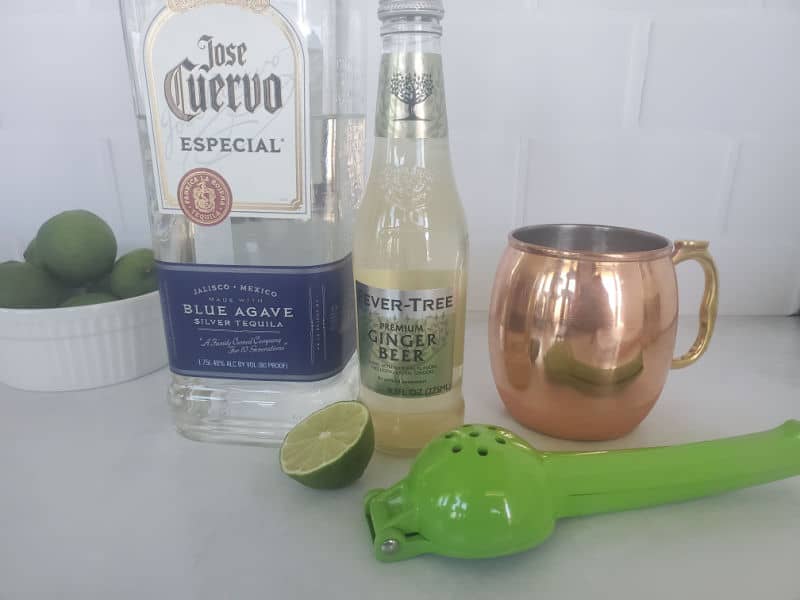 Mexican Mule ingredients Jose Cuervo silver tequila, ginger beer, lime, and a copper mule mug