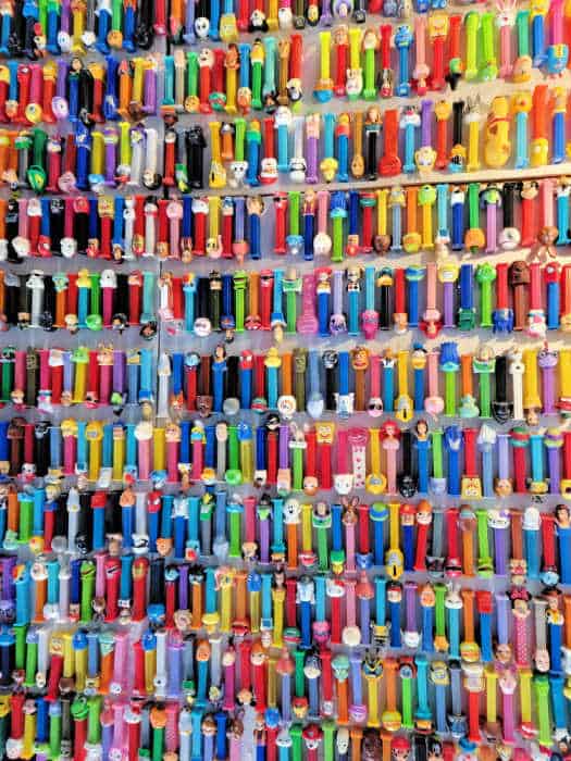 Pez dispensers lined up on a wall