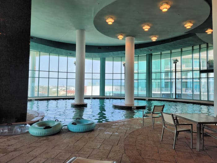 Indoor swimming pool with inner tubes, and a view out to the gulf of Mexico 