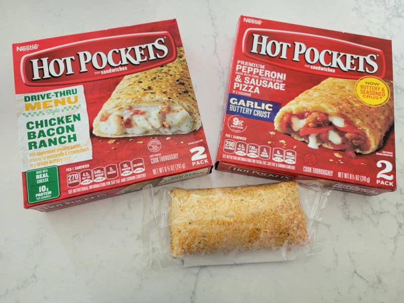 Hot pockets boxes next to a packages hot pocket