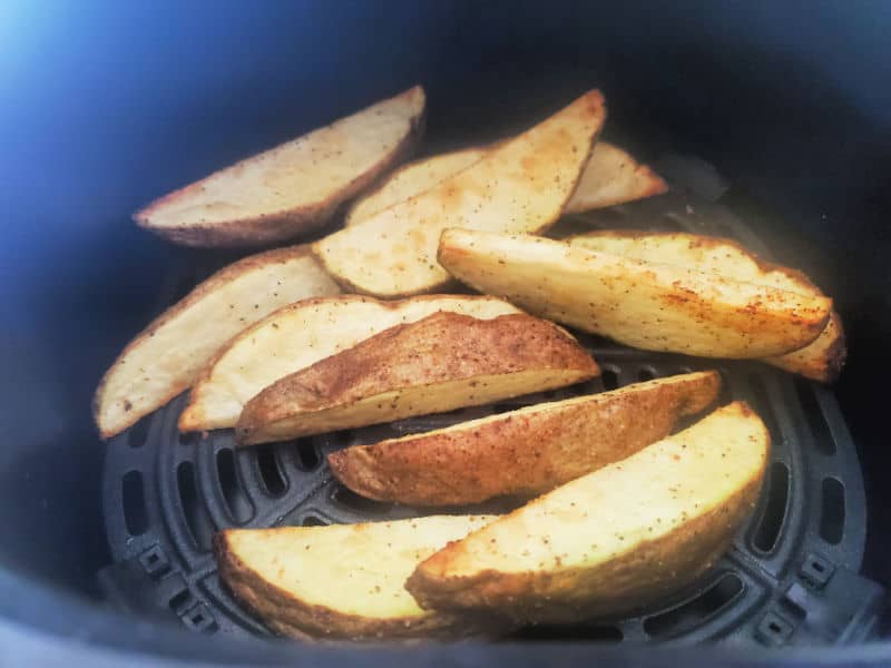 air fried potato wedges in the air fryer basket