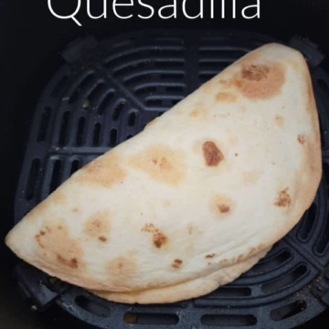 Air Fryer Quesadilla text over a quesadilla in the air fryer
