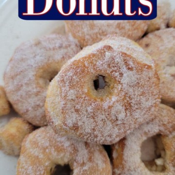 Air Fryer Donuts text over a plate with round doughnuts