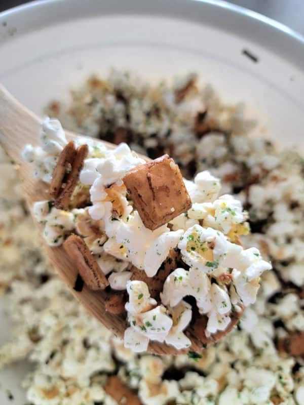 Wooden spoon holding popcorn with Mixed arare and furikake seasoning