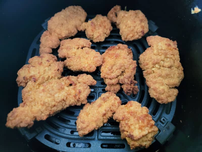 Chicken nuggets in an air fryer basket