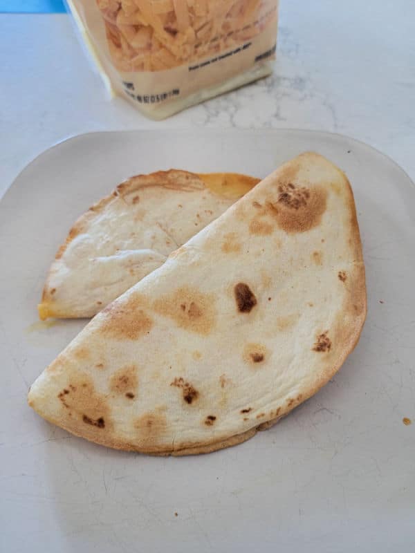 two air fryer quesadillas on a white plate