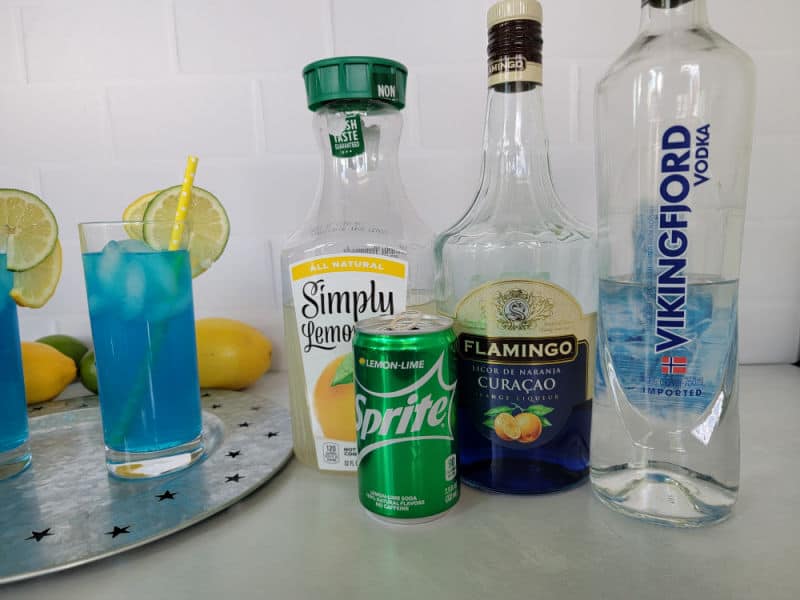 Electric Lemonade Cocktail ingredients, lemonade, sprite, blue curacao, and vodka with 2 cocktails 