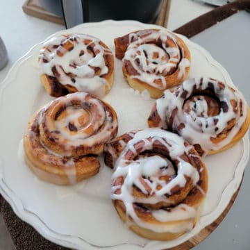 Air Fryer Cinnamon Rolls on a white plate