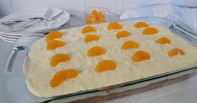 mandarin oranges on a pig pickin cake in a glass 9x13 cake pan