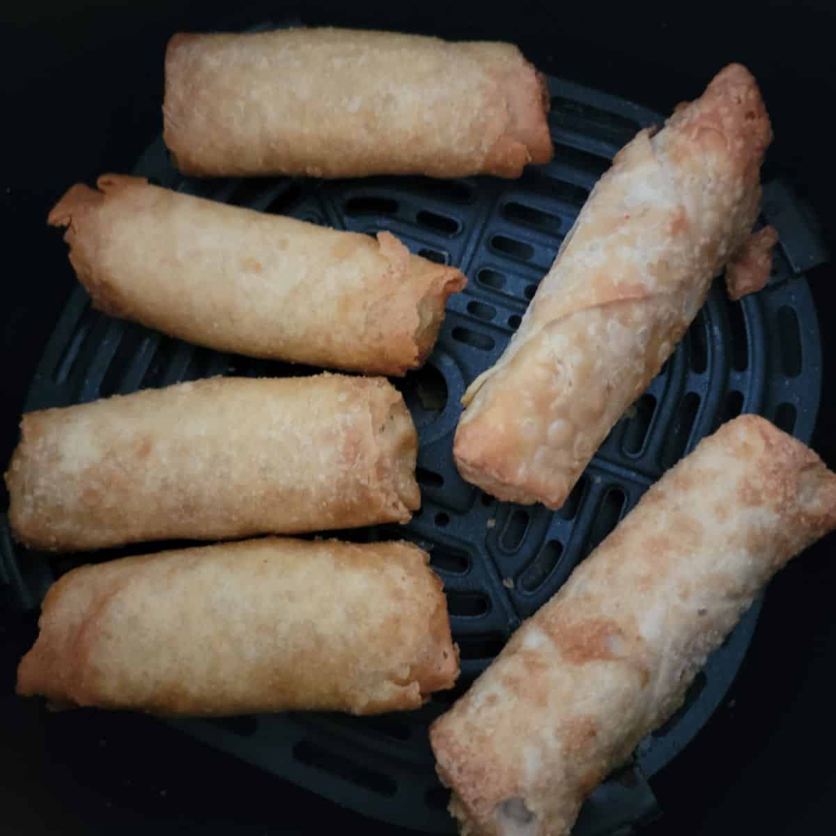 air fried egg rolls in the air fryer basket