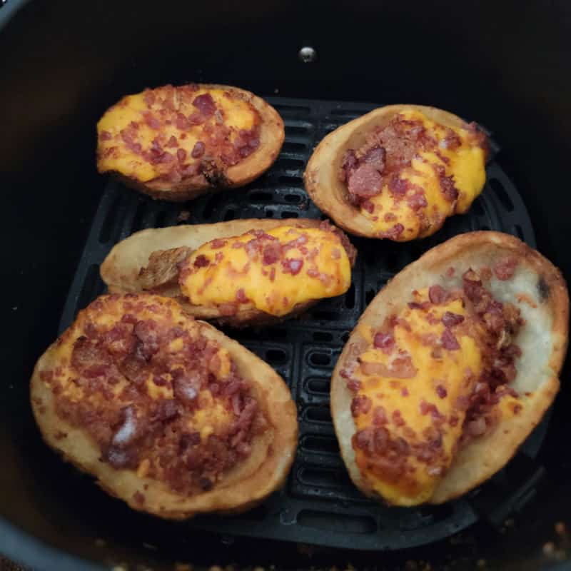 air fried frozen potato skins in an air fryer basket