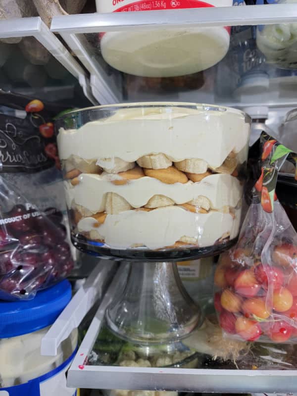 Magnolia Bakery Banana Pudding Recipe in a glass trifle dish in the refrigerator