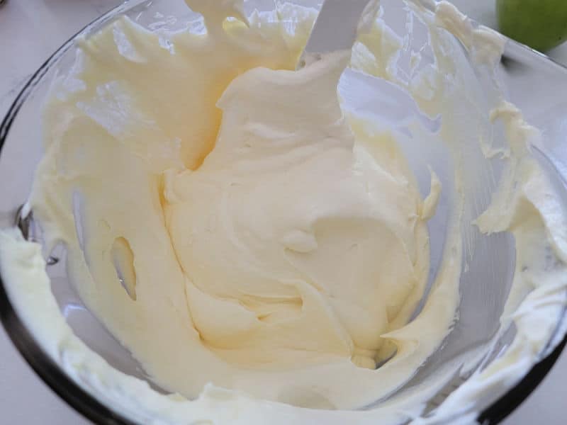 pudding and cool whip combined in a glass bowl. 