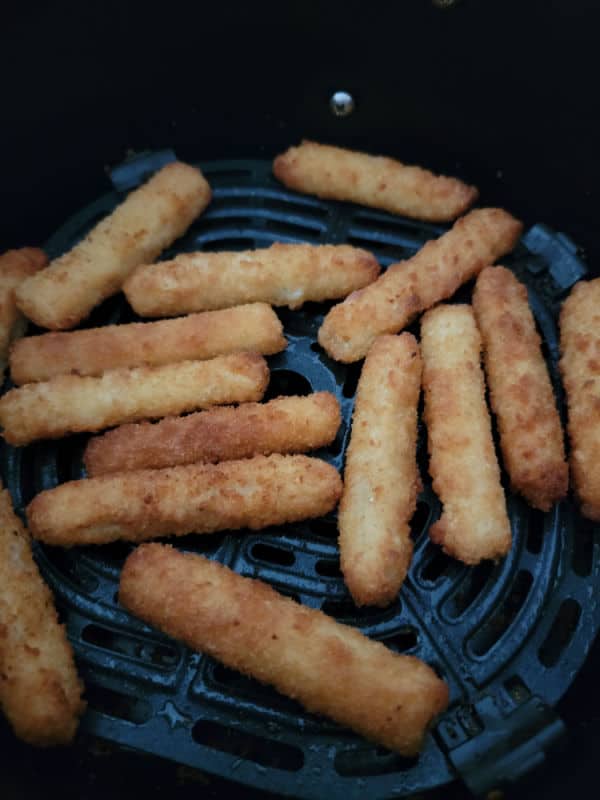 Air fried fish sticks in the air fryer basket