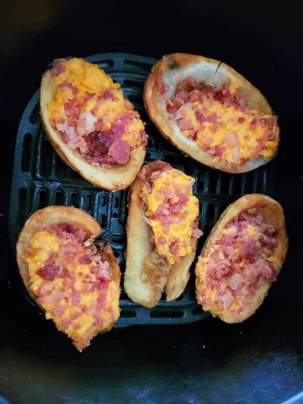 Frozen potato skins in an air fryer basket