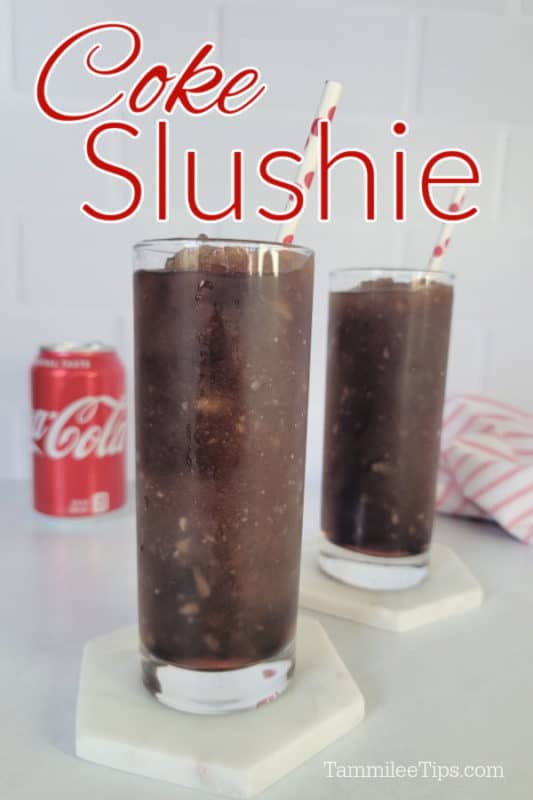 Coke Slushie text over two tall glasses on white coasters with a can of Coca Cola in the background