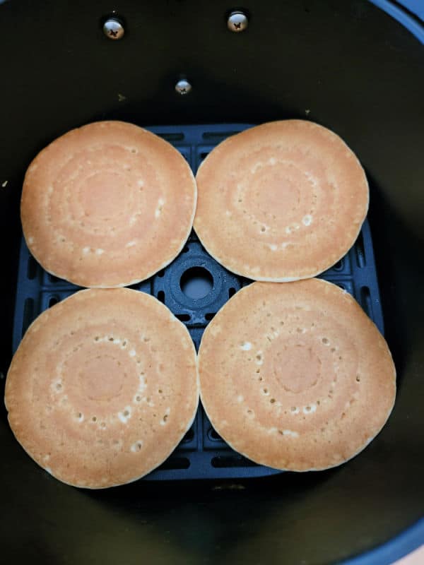 Frozen pancakes in an air fryer basket