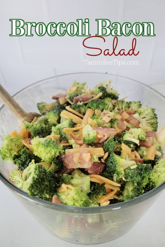 Broccoli Bacon Salad over a glass salad dish filled with broccoli salad and a wooden spoon