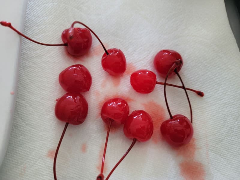 Maraschino cherries on a paper towel. 