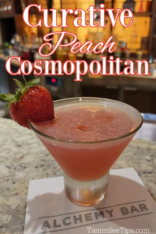 Curative Peach Cosmopolitan over a stemless martini glass on a white napkin