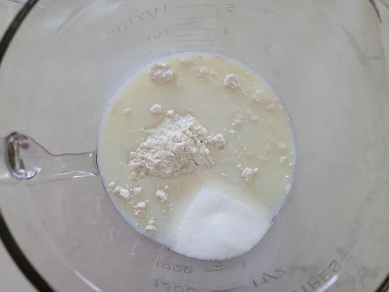 Milk with dry ingredients in a glass bowl 