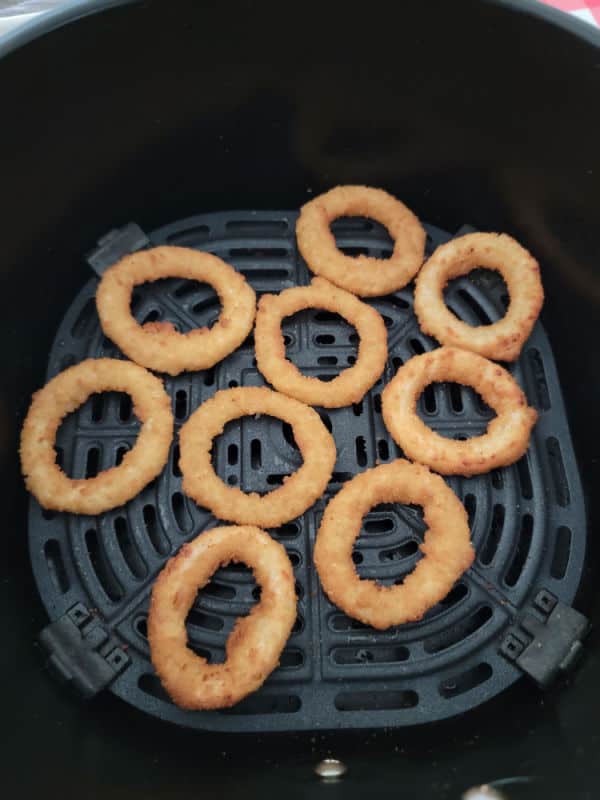 Air fried onion rings in an air fryer basket