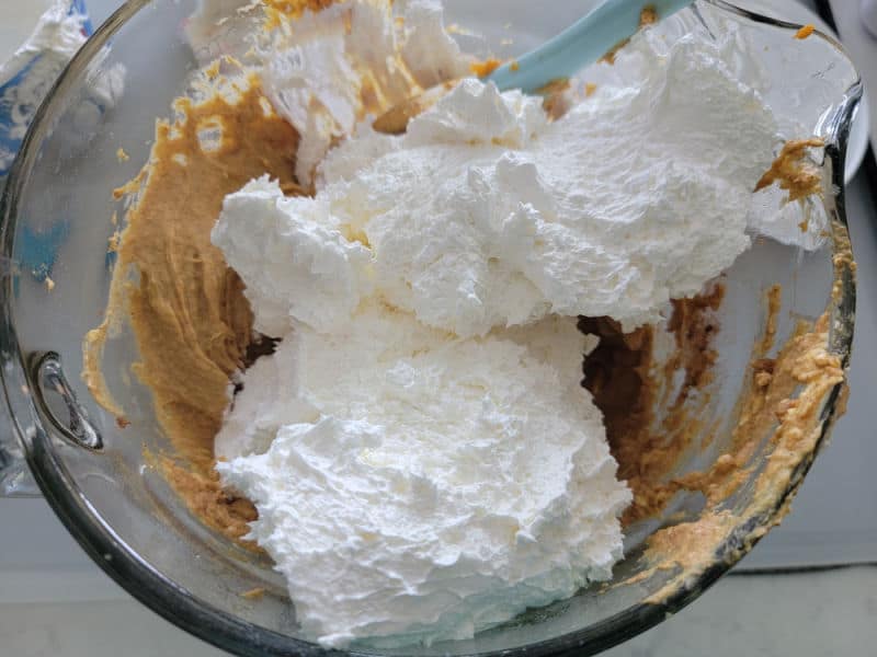Cool whip on pumpkin dip in a glass batter bowl