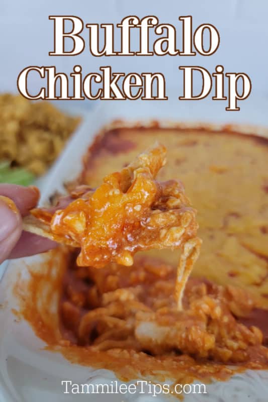 Buffalo Chicken Dip text over a white platter filled with buffalo chicken dip, hand holding a chip covered in dip