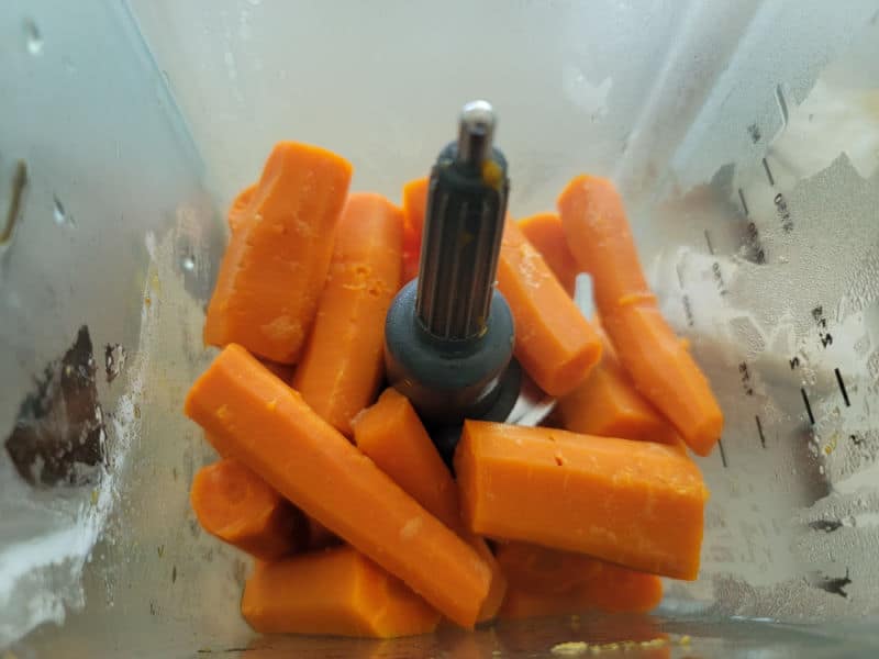 Cooked carrots in a blender for carrot souffle