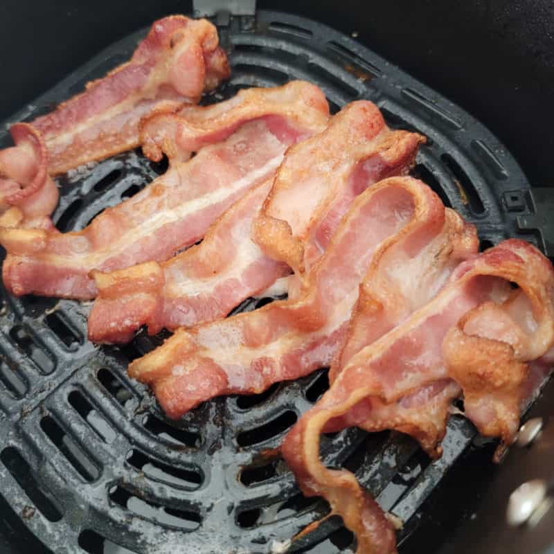 air fried bacon in an air fryer basket