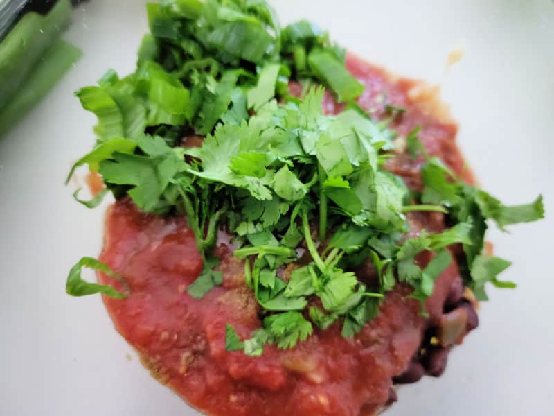 cilantro and salsa in a bowl
