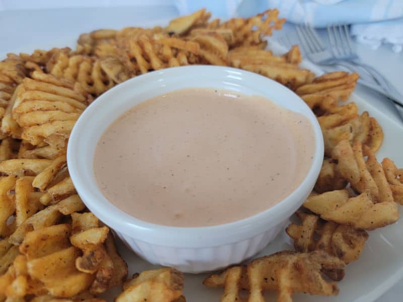 Comeback Sauce in a white bowl surrounded by waffle fries