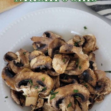 Air Fryer Mushrooms text over a white plate with seasoned mushrooms